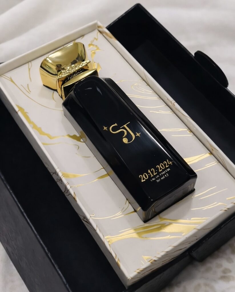 Custom engraved perfume bottle with initials SJ in luxury gift box in Qatar